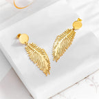 Large stylized feather earrings