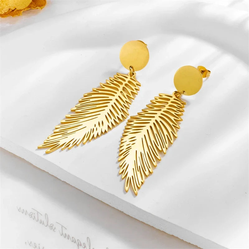 Large stylized feather earrings