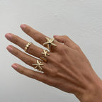 Set of 4 shell and starfish rings gold